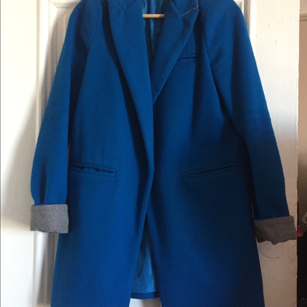 Tailored one button blue coat with contrast cuffs.
